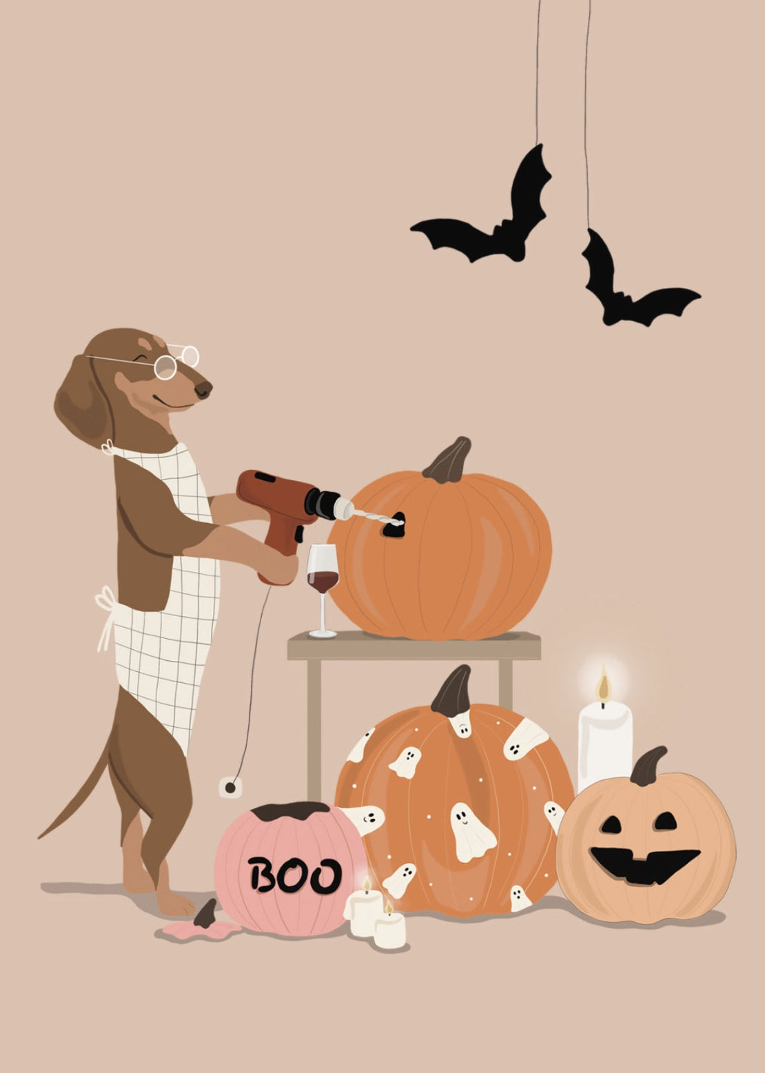 Halloween Postcard by Alfie's Greetings for Nobis Design featuring a brown dog wearing glasses and a white apron, carving pumpkins. The scene includes a pink pumpkin with 'BOO' written on it, a carved jack-o'-lantern, a lit candle, hanging bats, a glass of red wine and a warm beige background.