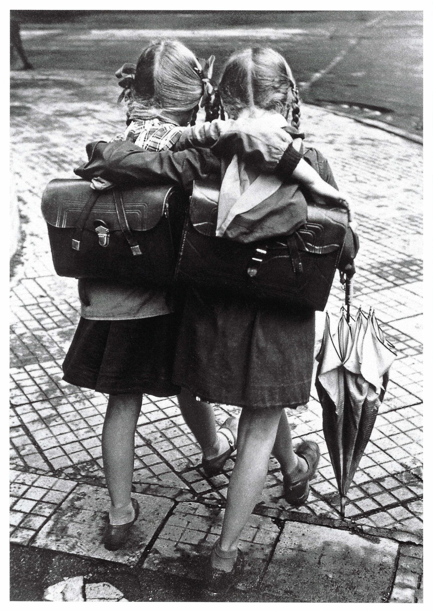 Black and white postcard by Skowronski & Koch featuring two school friends walking together—vintage street scene photography perfect for collectors, snail mail, and Postcrossing.