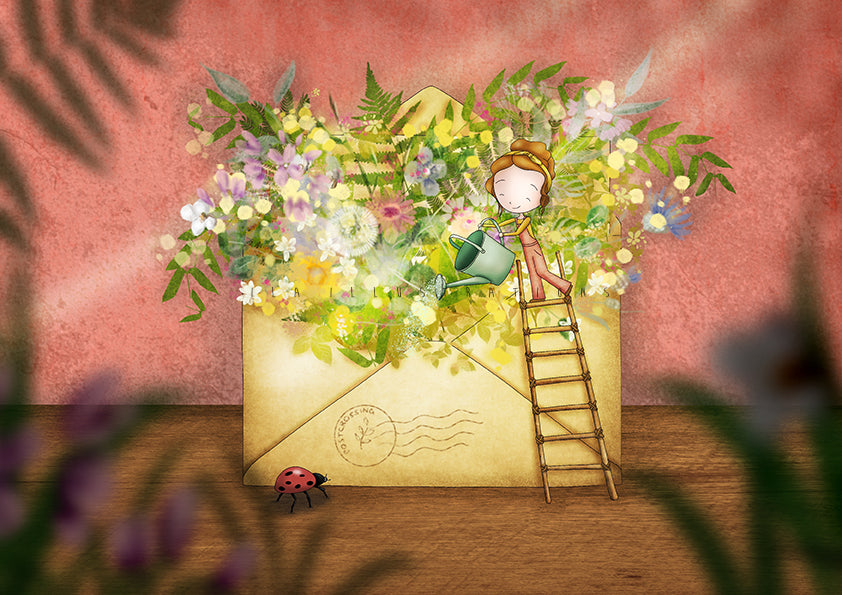 Spring Envelope Postcard by Ila Illustrations featuring a large cream-colored envelope on a wooden surface, overflowing with colorful wildflowers and green leaves. A small girl with a green watering can stands on a wooden ladder beside the envelope, reaching toward the flowers to water them and a ladybug is on the ground.