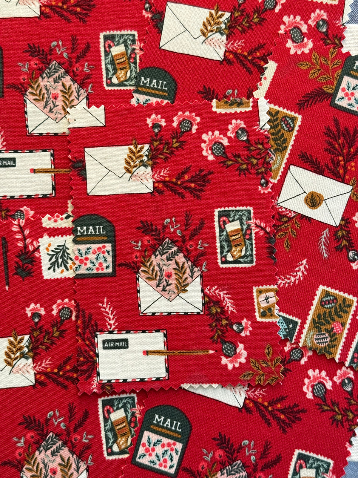 Merry Mail Fabric Postcard featuring envelopes, pencils, flowers and stamps.
