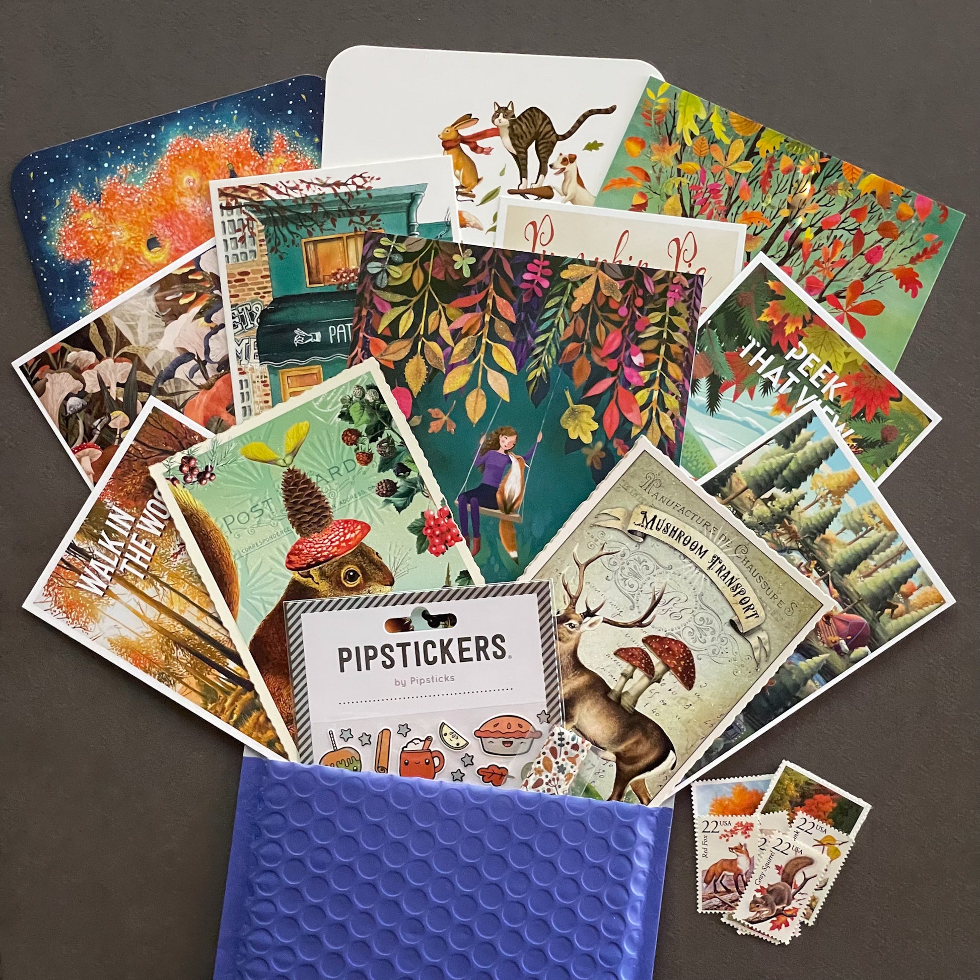 Autumn-themed postcard bundle with 13 illustrated cards, Pipsticks sticker sheet, and fall washi tape from Tiffany’s Postal Treats