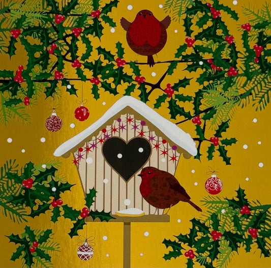 Christmas postcard by Kate Mawdsley - D’OR ET DE LUMIÈRE featuring a decorative holiday scene with a birdhouse, birds, and holly leaves on a gold foil background