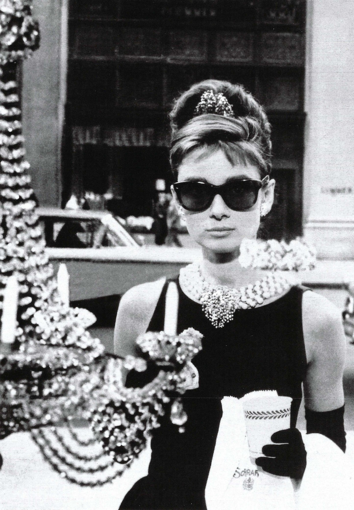 Black and white postcard featuring Audrey Hepburn in Breakfast at Tiffany’s—iconic film still from the Bettmann Archive, published by Catch Publishing, perfect for vintage collectors and Postcrossing.