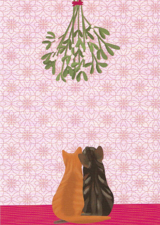 Cats under Mistletoe Postcard by Toni Starck for Nobis Design featuring two cats sitting side by side, facing a hanging bunch of mistletoe against a pale pink patterned background.