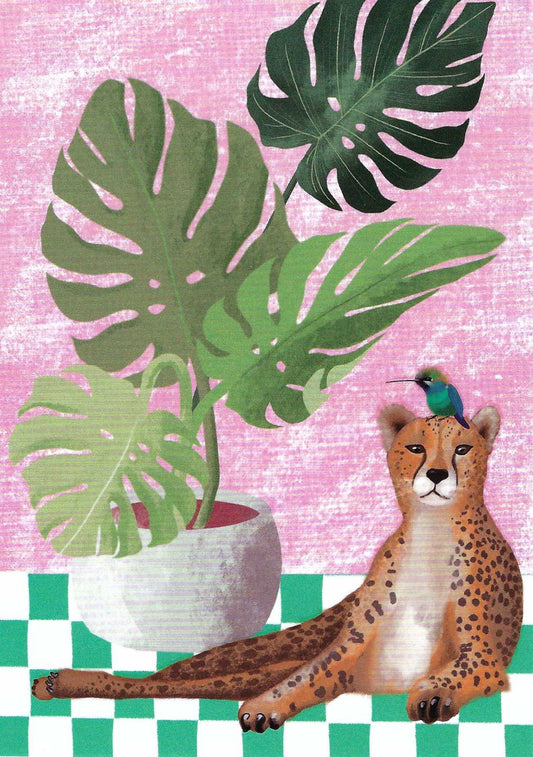 Cheetah and Hummingbird Postcard by Nobis Design featuring a potted plant and a spotted cheetah sitting on a green-and-white checkered floor against a pink textured background, with a small blue-green hummingbird on the cheetah's head.