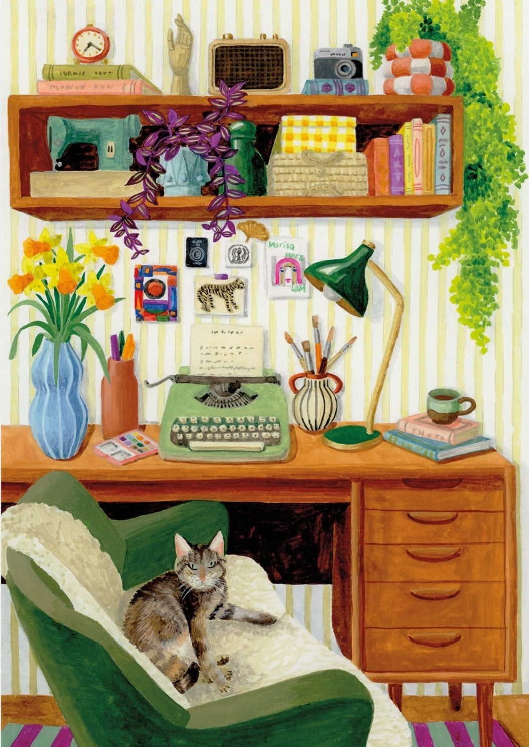 Coworking Cat Postcard by Mélanie Voituriez featuring a cozy illustrated home office scene with a green armchair holding a tabby cat, a wooden desk with a typewriter, books, flowers, shelves, and hanging greenery against striped wallpaper.