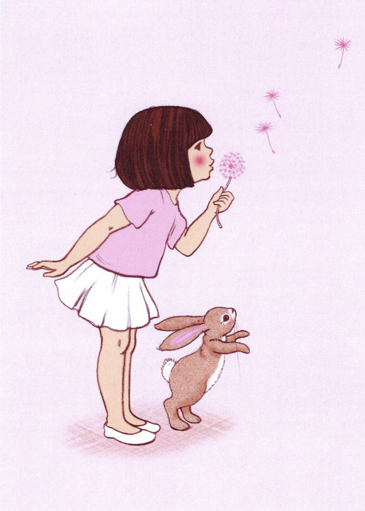 Dandelion Postcard by Belle and Boo featuring an illustration of a girl blowing a dandelion with a rabbit on a pink background