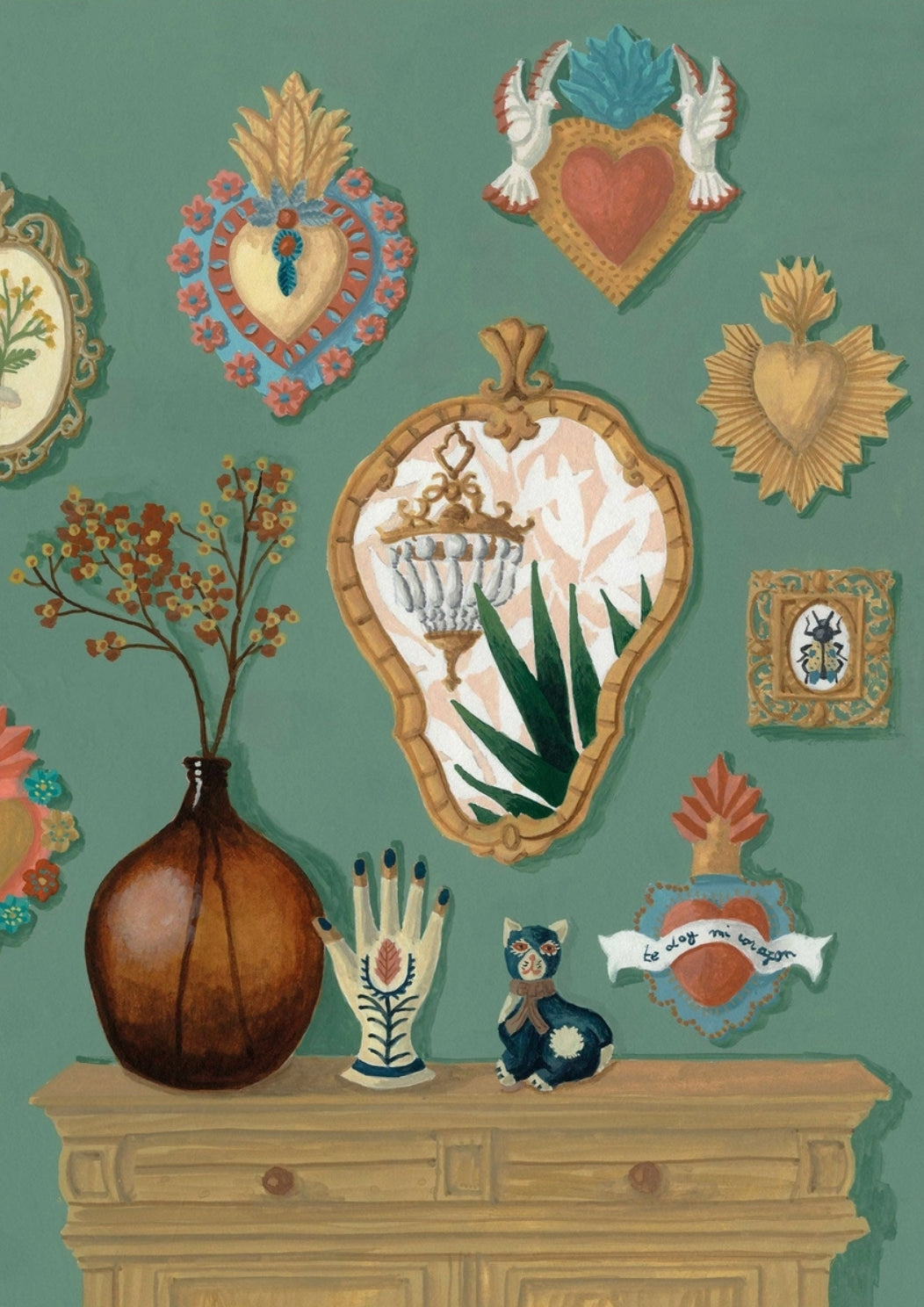Ex-Voto Postcard by Mélanie Voituriez featuring a teal wall adorned with ornate heart-shaped emblems, a large brown vase with dried branches, a wooden mantel with a hand-shaped candle holder and a small owl figurine, and a central gold-framed mirror.
