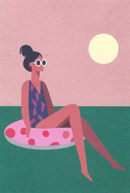 Girl in the Sea Postcard illustrated by Daria Ivanova for Nobis Desig featuring a woman sitting on a pink inflatable ring with a polka dot pattern, wearing sunglasses and a swimsuit, against a pink sky with a yellow sun.