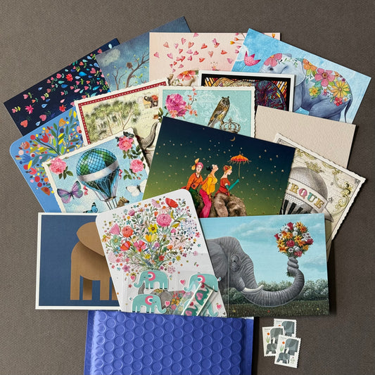 Curated Elephant-themed postcard pack featuring 15 illustrated postcards with glitter, foil, and jagged-edge details, matching stickers, and washi tape—perfect for snail mail lovers, Postcrossing and collectors.
