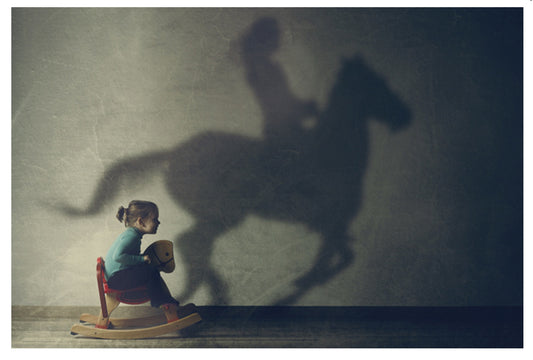 Lantern Press postcard featuring a vintage-style photograph of a girl with a rocking horse