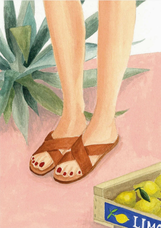 Lemons Postcard by Mélanie Voituriez featuring a crate of lemons next to a girl with sandals on and a tropical plant.
