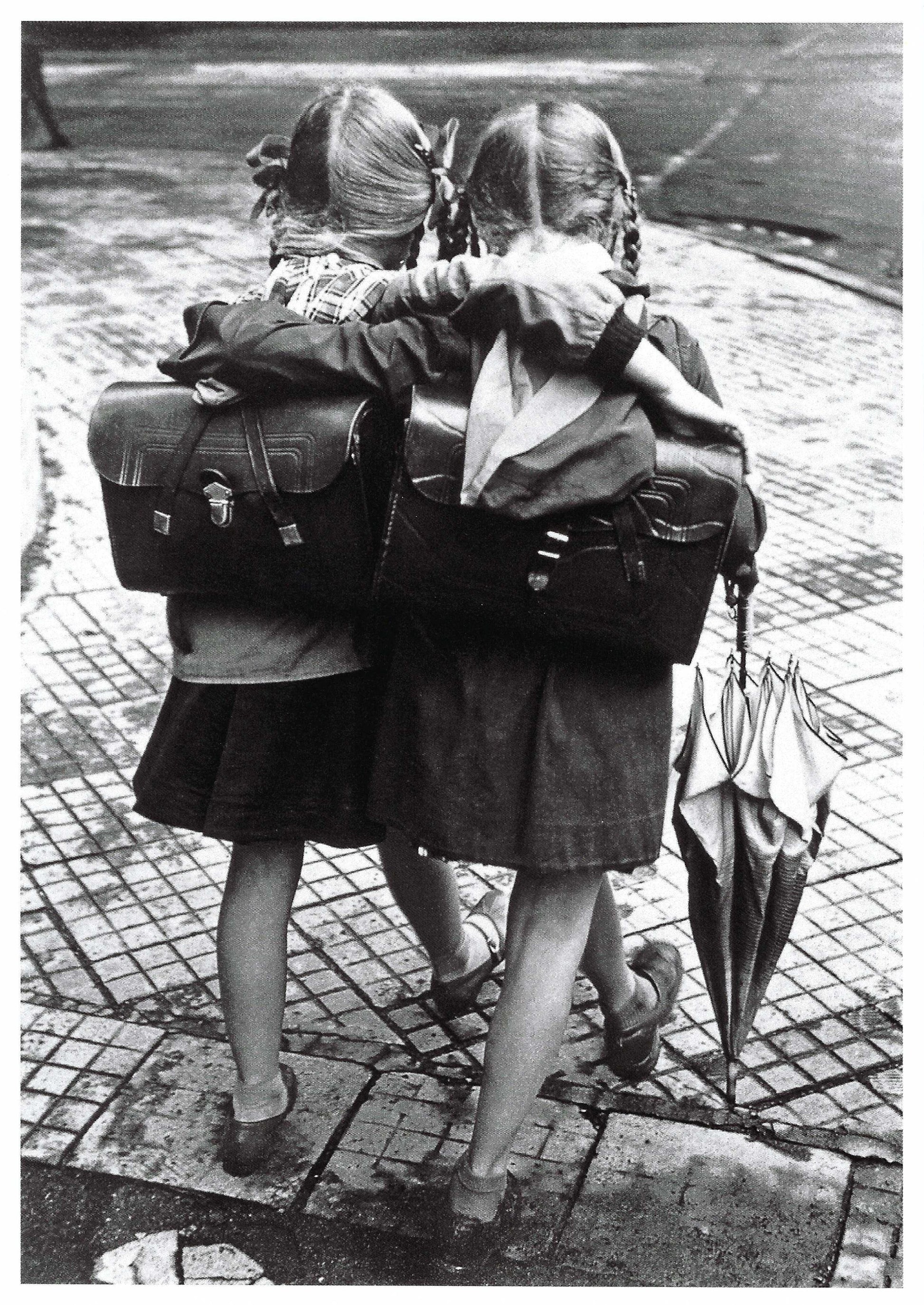 Black and white postcard by Skowronski & Koch featuring two school friends walking together—vintage street scene photography perfect for collectors, snail mail, and Postcrossing.