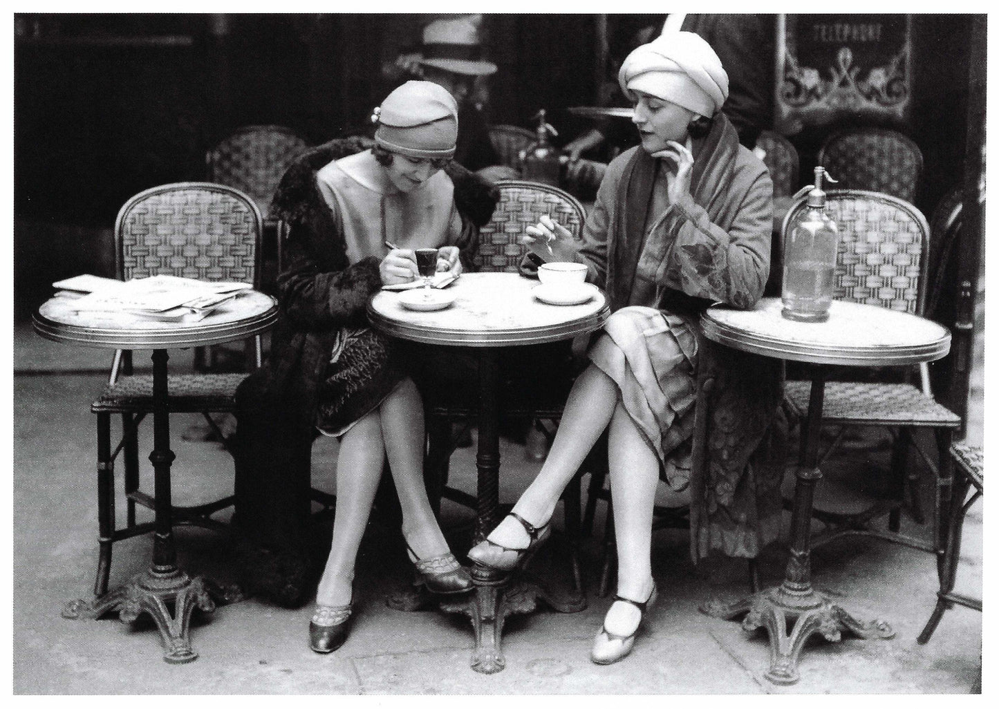 Black and White postcard of Two women sitting at a cafe table in a vintage setting-perfect for snail mail and Postcrossing