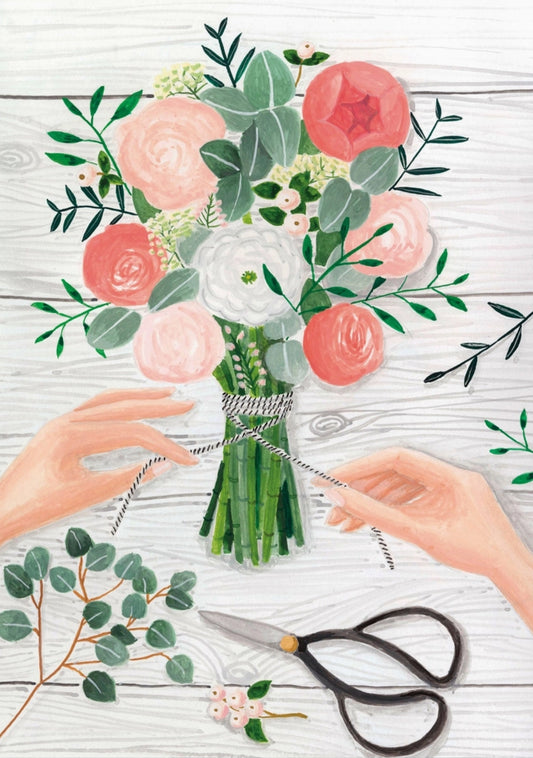The Bouquet Postcard by Mélanie Voituriez featuring an illustration of hands arranging a bouquet of flowers on a wooden surface with scissors.