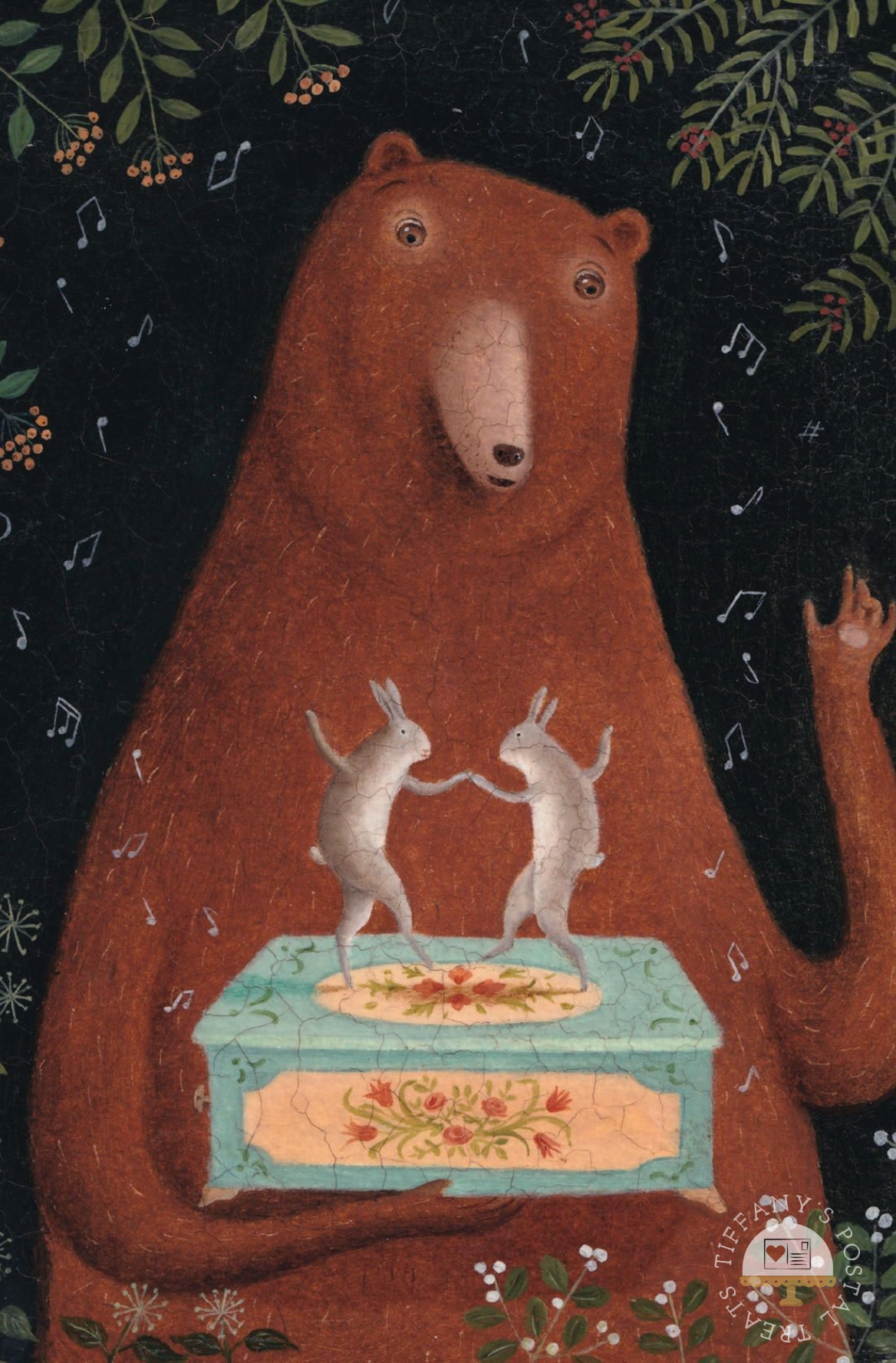 The Music Box Postcard by Inkognito featuring a folk-art style illustration of a large brown bear holding a light blue music box with two white rabbits dancing on top, set against a dark background with musical notes and floral details.