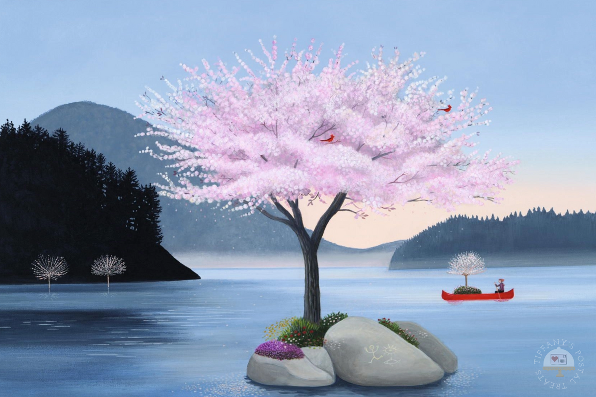 The Tree Planter Postcard by Inkognito featuring a large pink flowering tree on a rocky shore in the foreground, with calm blue water, dark forested hills, and a small red canoe on the water. Red cardinal birds are in the pink tree.