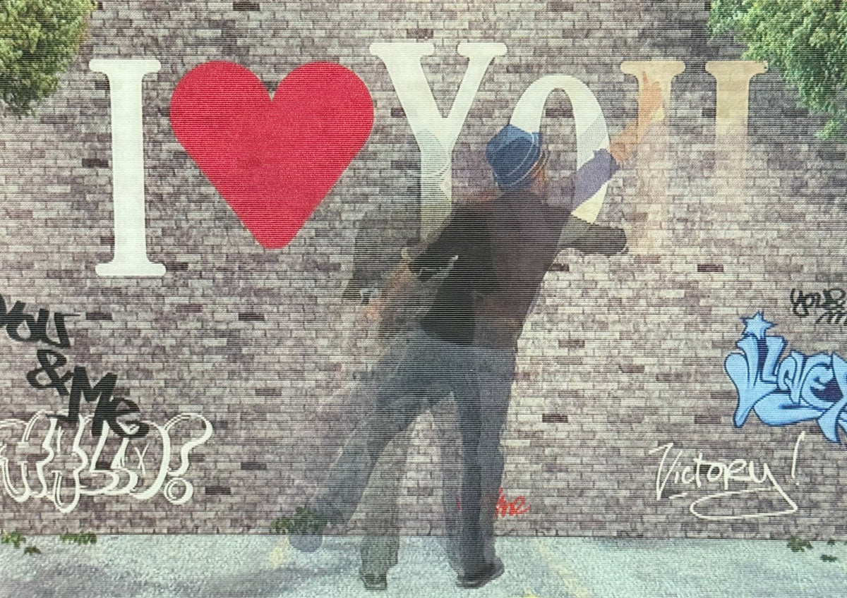 I Love You Graffiti Lenticular Postcard by L.M. Kartenvertrieb featuring a Person spraying I Love You on a graffiti brick wall.
